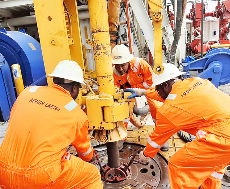 Aspow Limited oil field workers wearing branded coverall