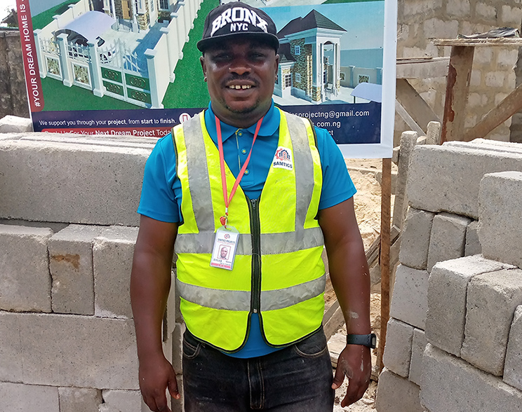 Samtics Project engineer on site with branded vest designed and printed by Simtech Creative™